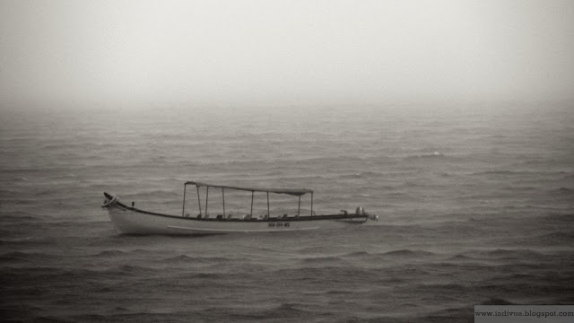 Lonely boat floating in the Arabian Sea