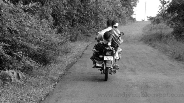 Family on a bike without helmet
