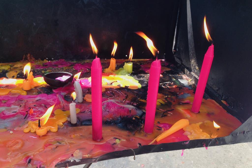 Colorful candles burning outside Chennai church in India