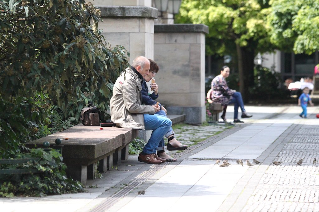 People feeding the birds in Berlin