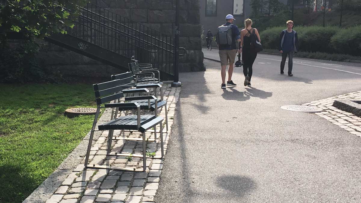 Benches for one person by the Baana
