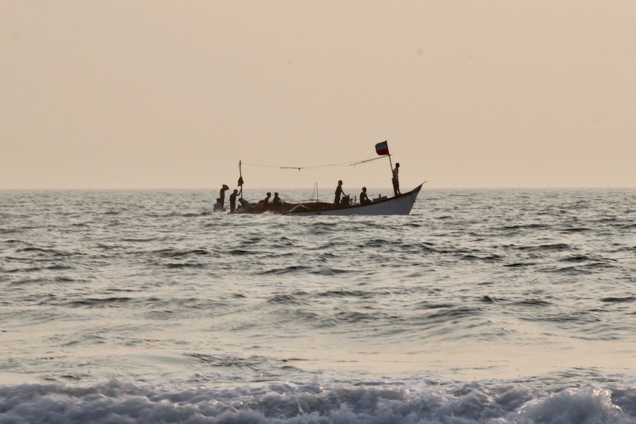 Goan fishermen sailing at Arabian Sea during sunset