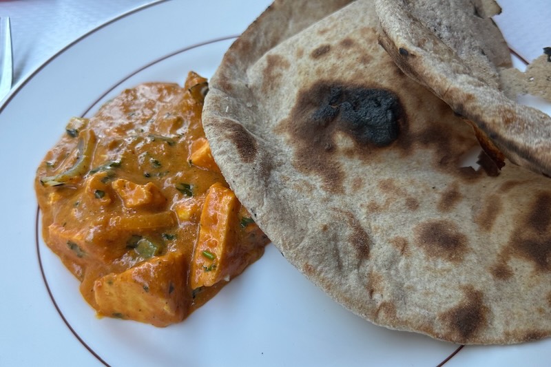 One of the naan breads was very badly burnt. Avoid eating this black burnt food, since it is one cause of cancer.