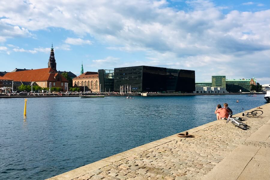 People sitting by the shore in Copenhagen centre